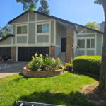 Two-story Sacramento home with freshly painted gray exterior and white trim