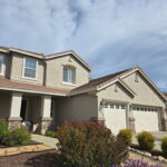 Freshly painted gray and white suburban home exterior in Sacramento