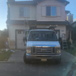 Jay’s Painting Service work van at a residential exterior painting project